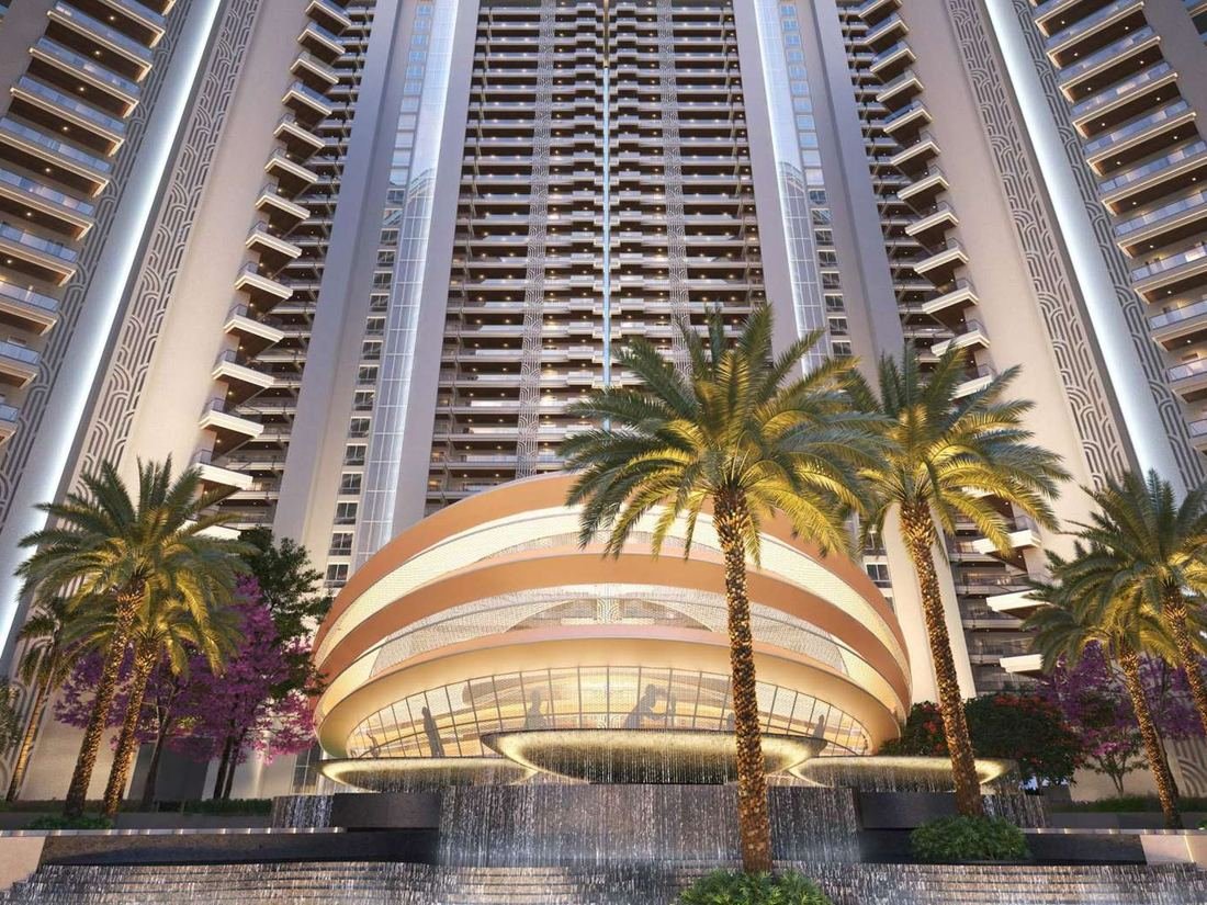Artist’s impression of the arrival court at VVIP Addresses with a cascading water feature, palms and the residential towers rising behind.