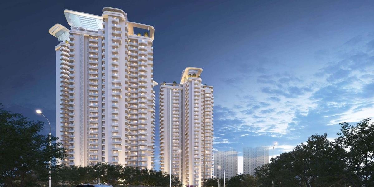Artist’s impression of the VVIP Addresses towers at dusk seen from the approach road.