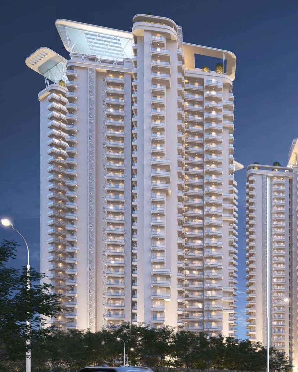 Artist’s impression of a VVIP Addresses tower at dusk, seen from the approach road.